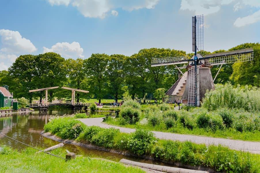 The Open Air Museum in Arnhem with its lovely old mill, directly by the canal, surrounded by lush green meadows
